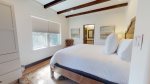 Master bedroom with king size bed and crisp cotton linens